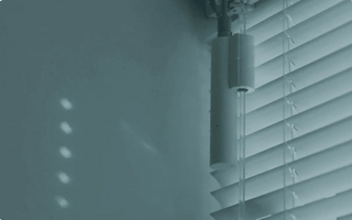 Smart motorized blinds with sleek cylindrical control unit for automated home window shading