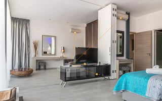 Modern smart home bedroom with connected AC, smart switches, and TV automation