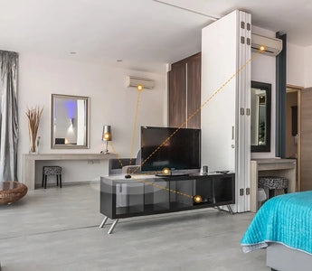 Modern smart home bedroom with connected AC, smart switches, and TV automation