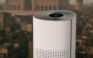 Smart air purifier with digital display on rooftop, city and mosque in background