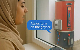 Woman using Alexa smart speaker to voice control electric geyser switch for home automation